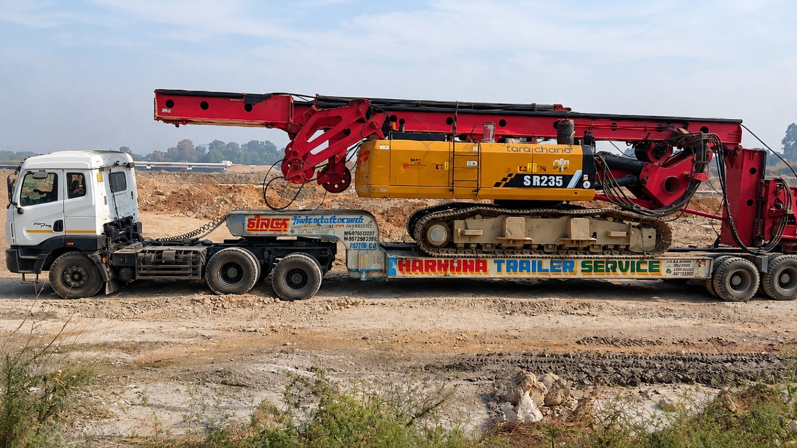 Heavy drilling rig transported on trailer