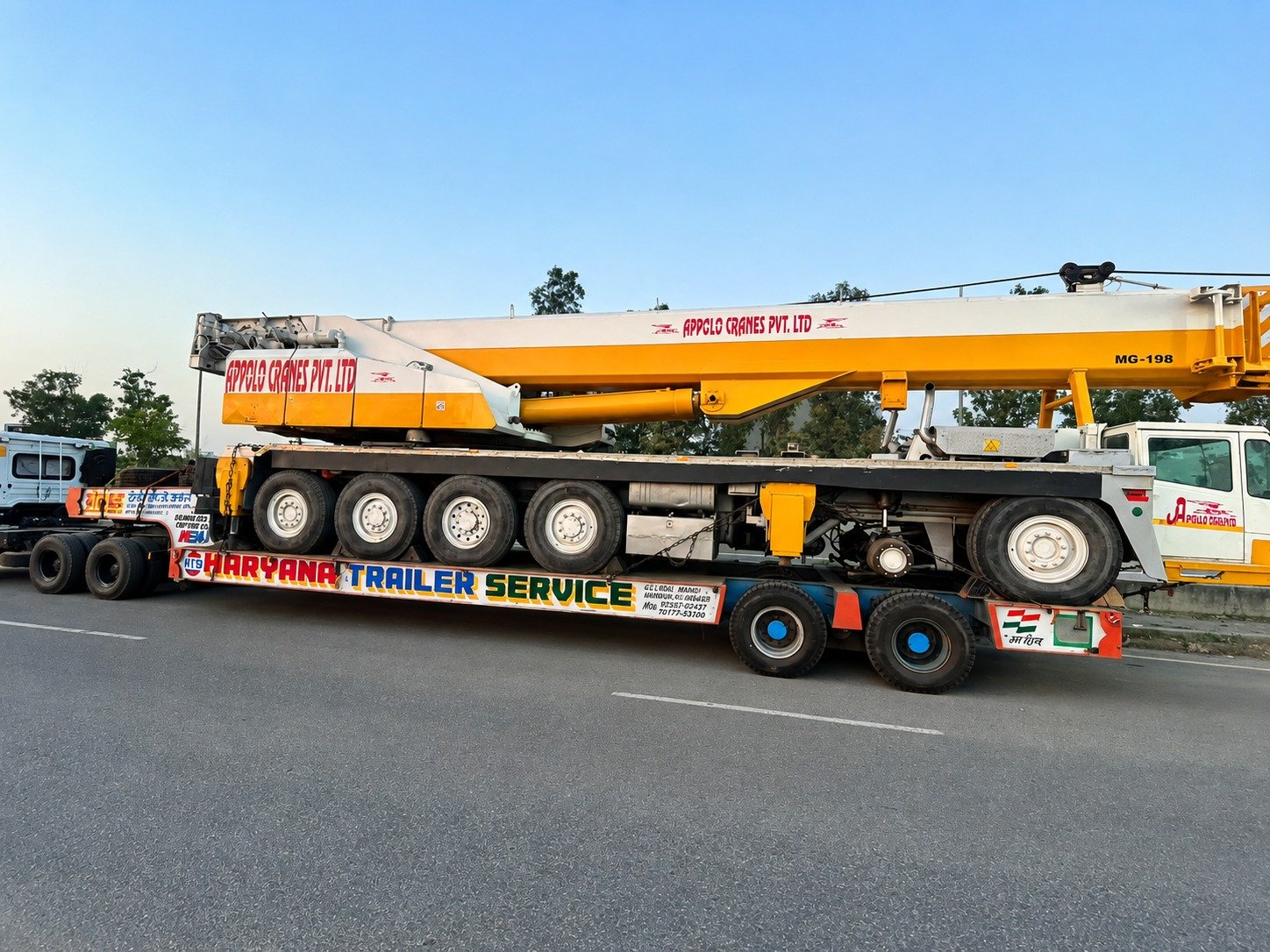 Mobile crane transported on low-bed trailer