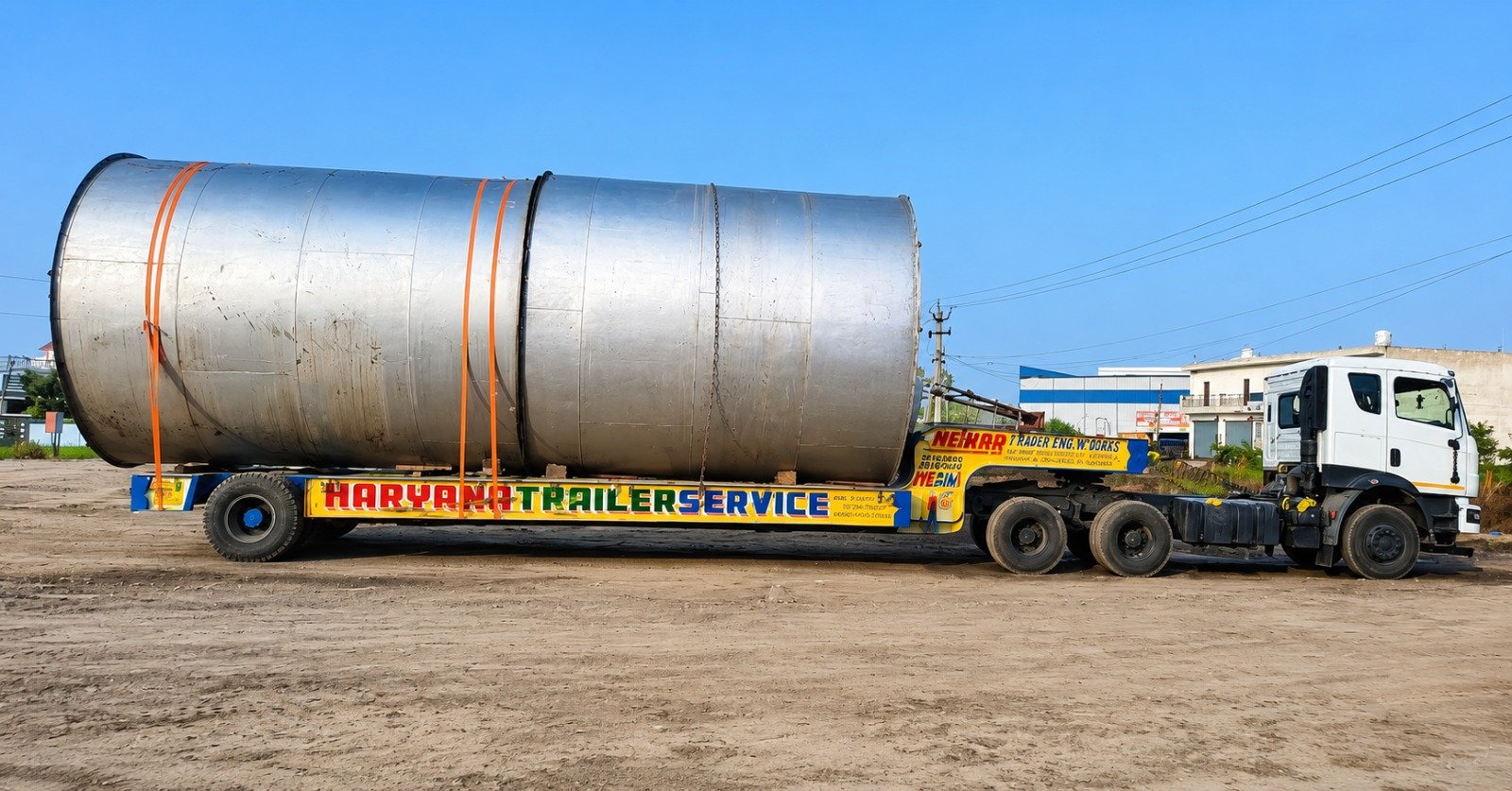 Oversized industrial vessel transported on trailer