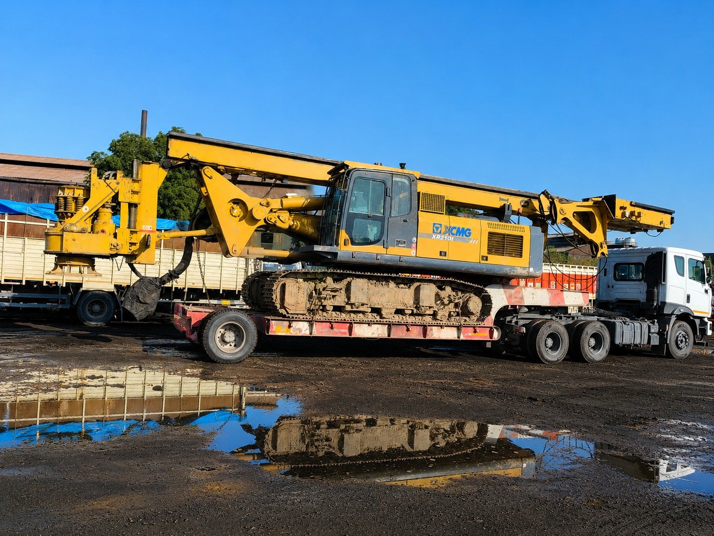 Heavy drilling machinery transported on trailer